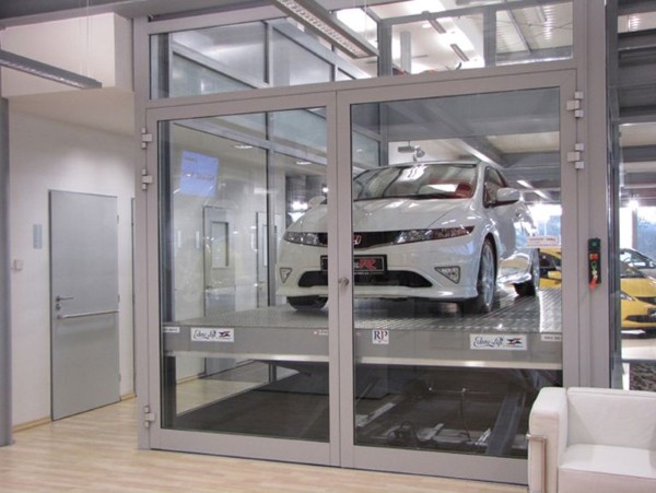 Thang máy tải ô tô được thiết kế với mục đích chính là nâng, hạ ô tô giữa các tầng